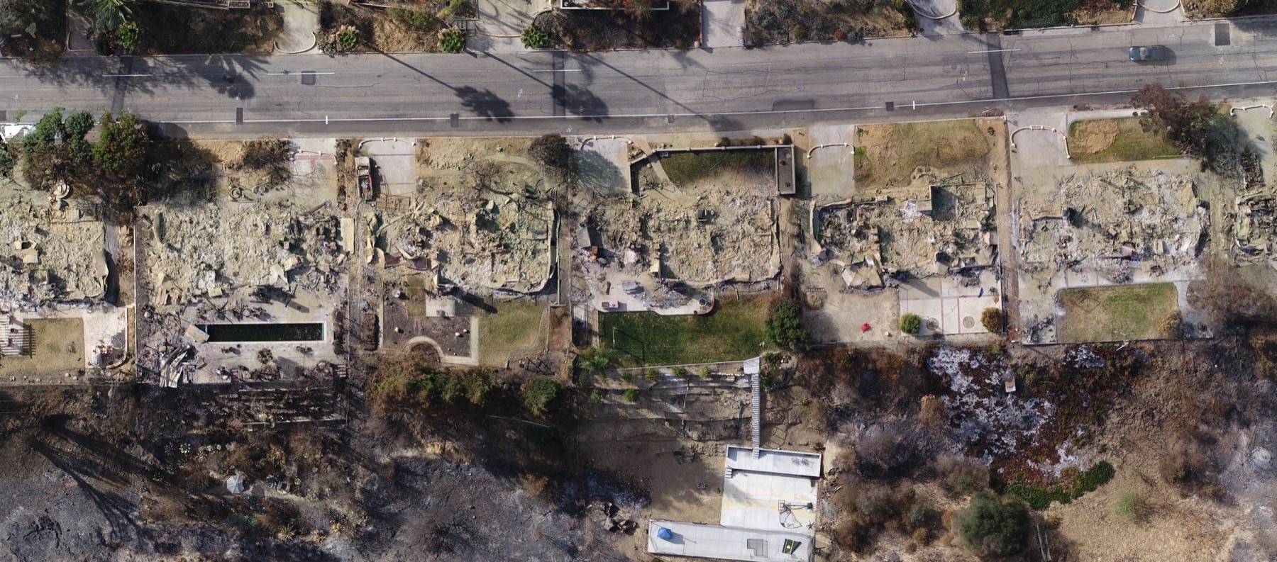 Photo showing houses before the fire - courtesy of Google Earth - and after - courtesy of WM Surveys using the Aerotas Mapping System